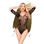 Preview: Woman in black lace bodysuit against a golden background, hands behind her head, blonde hair, red lipstick.