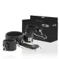 Preview: Black handcuffs with chain, packaging in the background, product name "Fetish Submissive".