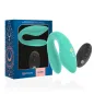 Preview: Türkiser Paarvibrator mit Fernbedienung und Verpackung, verziert mit geometrischen Mustern.