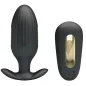 Preview: Black, ribbed, oval device with gold accents, next to a matching, rounded accessory.