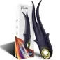 Preview: Schwarzer Vibrator mit goldenen Akzenten vor einer Verpackung mit buntem Design.