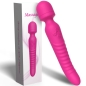 Preview: Pink massage device with ribbed handle and controls, next to matching packaging.