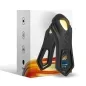 Preview: Black silicone toy with yellow accents in front of packaging with colorful design and symbols.