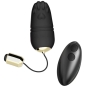 Preview: Schwarzes, eiförmiges Massagegerät mit Pfotenmuster und Fernbedienung, goldene Akzente.