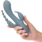 Preview: Hand hält blauen Vibrator mit mehreren Anhängen vor weißem Hintergrund.