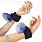 Preview: Two hands with black handcuffs and blue suction cups, tattooed, against a white background.
