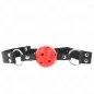 Preview: Black leather strap with red ball and metal rings, used as a gag.