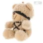 Preview: Plush bear with black band around its eyes and body, sitting upright.