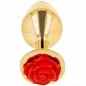 Preview: Goldener Plug mit roter Rosenverzierung am Ende, auf weißem Hintergrund.