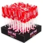 Preview: Rote Lutscher in Penisform auf einem schwarzen Display mit der Aufschrift "EAT ME Strawberry Jelly Lollipop".