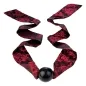 Preview: Red patterned ribbon with a black ball in the middle, decoratively draped.
