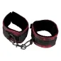 Preview: Black and red handcuffs with buckles and hooks, on a white background.