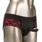 Preview: A mannequin is wearing black and red lace lingerie with an attached dildo.
