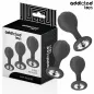 Preview: Black anal plug set in three sizes, decorated with crystals, next to the packaging of "Addicted Toys".