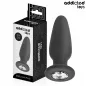 Preview: Black anal plug with gemstone, 12.6 cm, next to packaging from Addicted Toys.