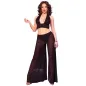 Preview: Woman in black, transparent outfit with wide culottes and top, posing in front of a white background.