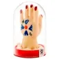 Preview: Artistic hand in a glass dome with red nails and a blue drawing on the back of the hand.