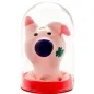 Preview: Rosa Schweinchenfigur mit blauer Nase und Kleeblatt, in einer durchsichtigen Kuppel auf rotem Sockel.