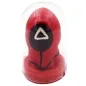 Preview: Red game piece with a black circle and white triangle, in a transparent plastic case.
