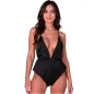 Preview: Woman in a black, low-cut jumpsuit against a white background.