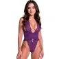 Preview: Woman in purple lace bodysuit with deep neckline, smiles at the camera.