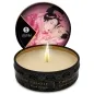 Preview: Round massage candle with burning flame, lid shows Japanese art with two people in pink robes.
