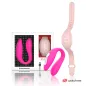 Preview: Pinkes Wearable-Gerät mit Verpackung und USB-Kabel, daneben ein rosa Armband mit Knöpfen.