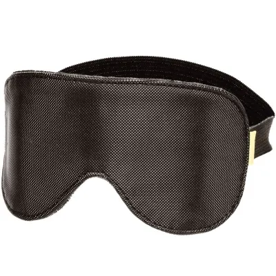 Black sleep mask with elastic band, textured material.