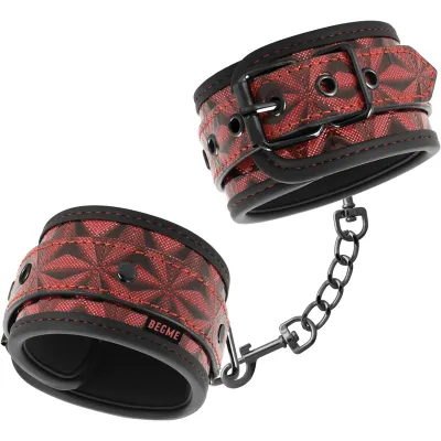 Red handcuffs with black pattern and chain, adjustable with buckles.