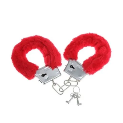 Red plush handcuffs with two keys on a white background.