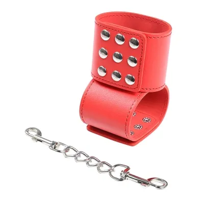 Red leather bracelet with silver studs and detachable chain.