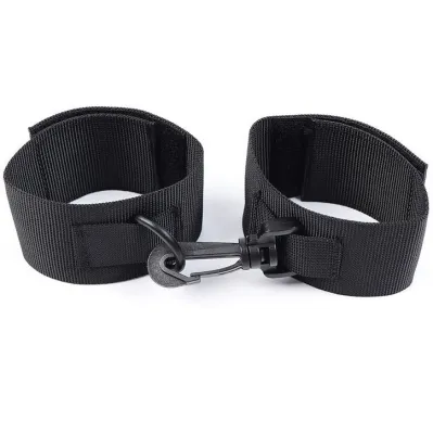 Black nylon handcuffs with Velcro closure and carabiner hook on a white background.