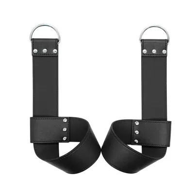 Two black leather restraints with silver D-rings and rivets on a white background.