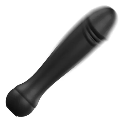 Black, elongated object with rounded ends and a smooth surface, shown slightly blurred.