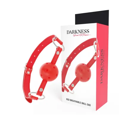 A red ball gag with holes and an adjustable strap, next to a package labeled "Darkness".