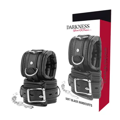 Black, soft handcuffs with buckles and chain, packaged in a box labeled "Darkness".