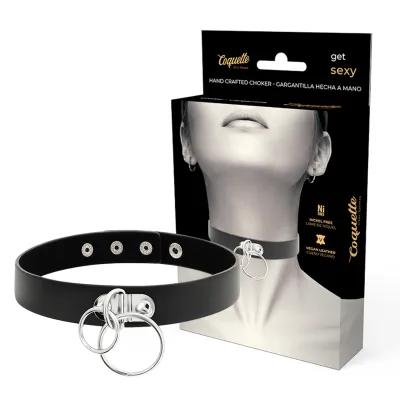 Black choker necklace with silver rings, packaged in a box with a picture of a neck.