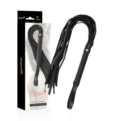 Black vegan leather flogger with packaging, brand name "Coquette Fantasy".