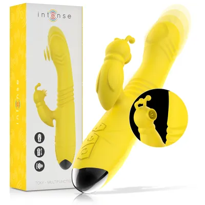 Yellow vibrator with packaging, close-up of a detail, black accent at the tip.