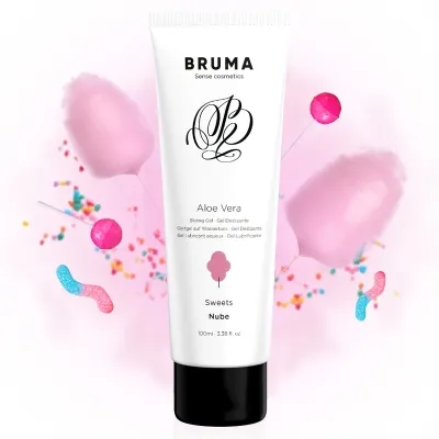 Tube of aloe vera gel surrounded by cotton candy, lollipops and colorful sprinkles on a white background.