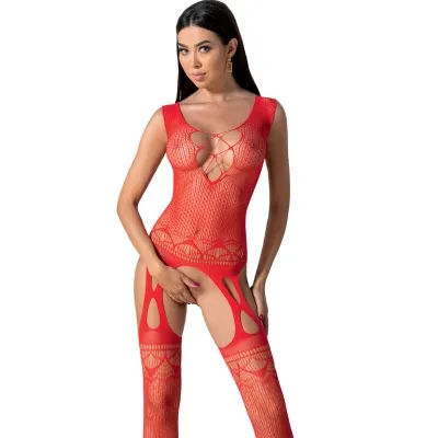 Woman in red, openwork bodystocking with geometric pattern, posing in front of a white background.