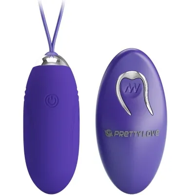 Purple vibrator with remote control, both with silver accents, on a white background.
