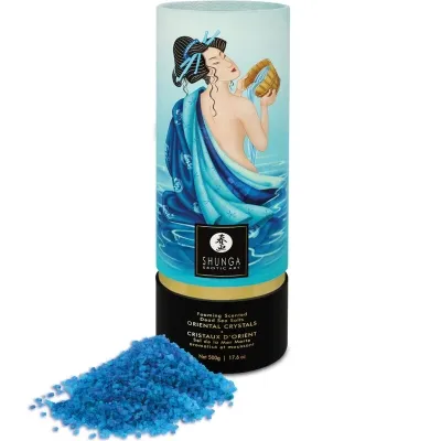 Packaging of Shunga bath salts with an oriental design, blue crystals next to it.
