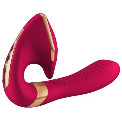 Roter, ergonomisch geformter Vibrator mit goldenen Akzenten und strukturiertem Griff.