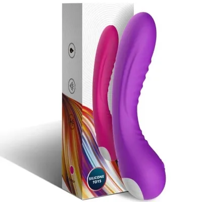 Purple and pink silicone vibrator in front of packaging with a colorful design and the inscription "Silicone Toys".