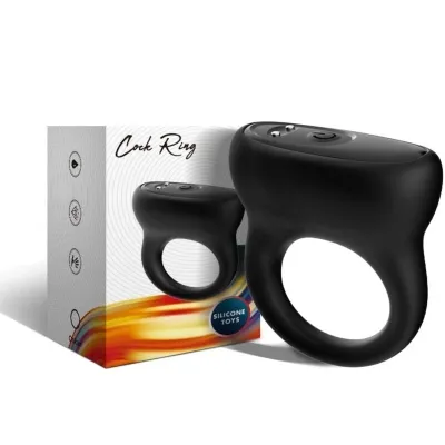 Black silicone cock ring with packaging in the background that says "Silicone Toys".
