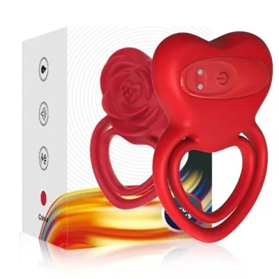 Red, heart-shaped product with two rings and packaging in the background.