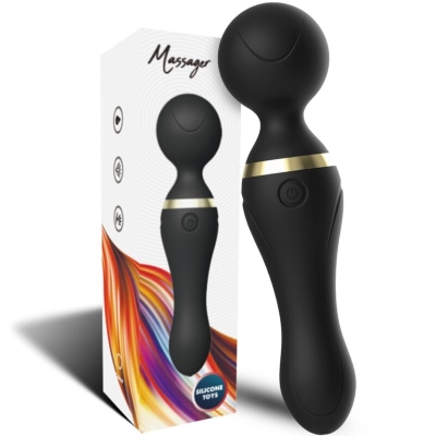Black massage wand with gold accents in front of packaging with a colorful design.