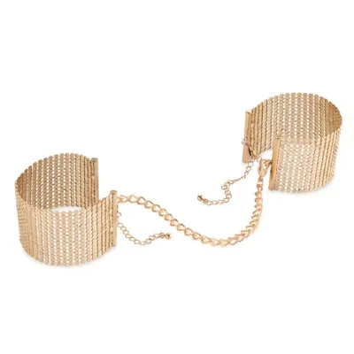 Golden cuff bracelets connected by chain links.