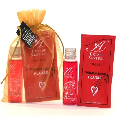 Red Extase Sensuel Set with bottle and bag, labeled "Woman Stimul Plaisir" and "Hot Oil, Strawberry".